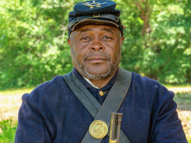 Terry James, Executive Director of Jamestown Foundation, wearing Civil War era Union soldier uniform